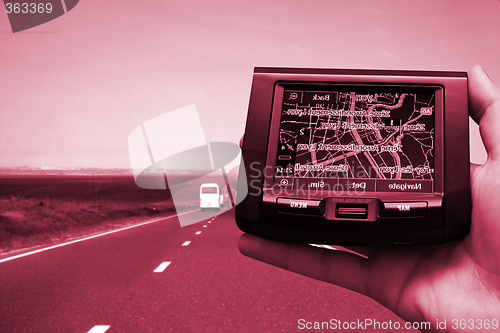 Image of GPS Vehicle navigation system in a man hand.