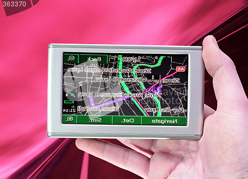 Image of GPS Vehicle navigation system in a man hand.