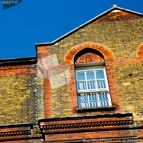 Image of old windon in england london brick and glass the wall 