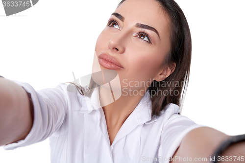 Image of Beautiful woman taking selfie