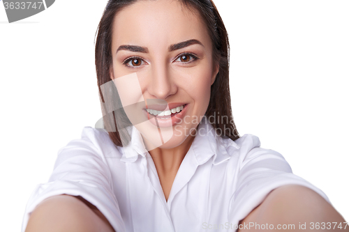 Image of Beautiful woman taking selfie