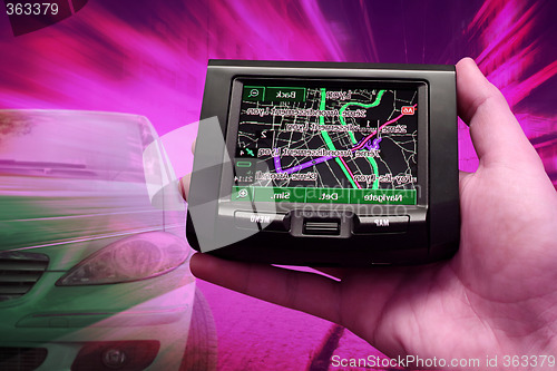 Image of GPS Vehicle navigation system in a man hand.