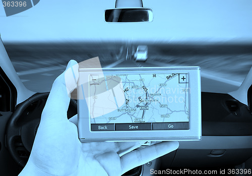 Image of GPS Vehicle navigation system in a man hand.