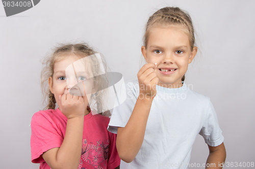 Image of Six year old girl showing her teeth, four-year girl afraid of toothache