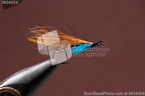 Image of Blue and orange fishing fly