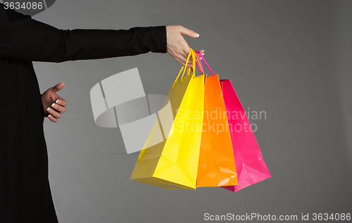 Image of Holding shopping bags