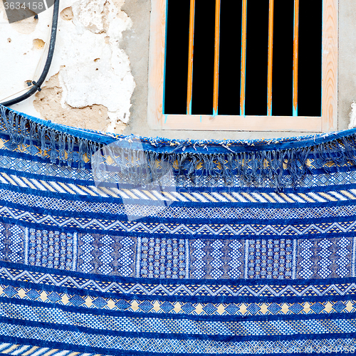 Image of blue window in morocco africa old construction and brown wall re