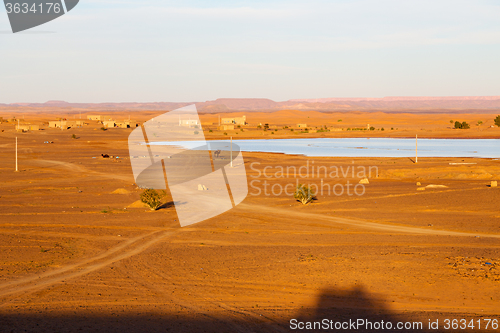 Image of sunshine in the lake yellow  morocco sand and     