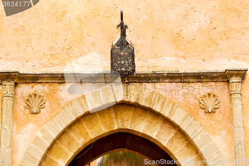 Image of old door in morocco africa  wall ornate   yellow