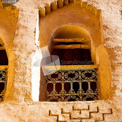 Image of   window in morocco africa old construction and brown wall  