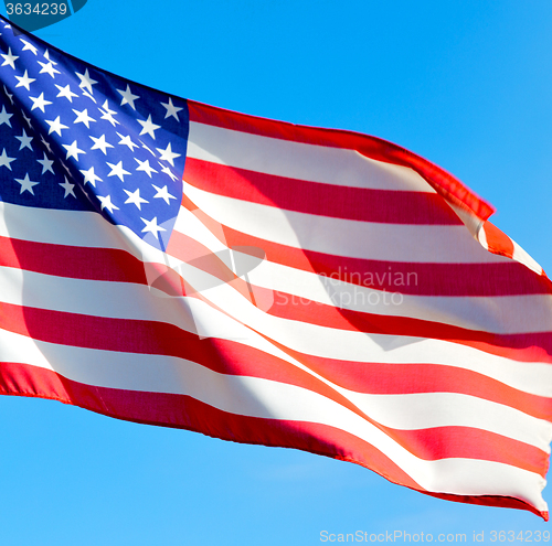 Image of usa waving flag in the blue sky bcolour and wave