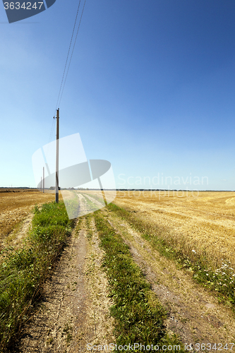 Image of rural road . Electric pole.