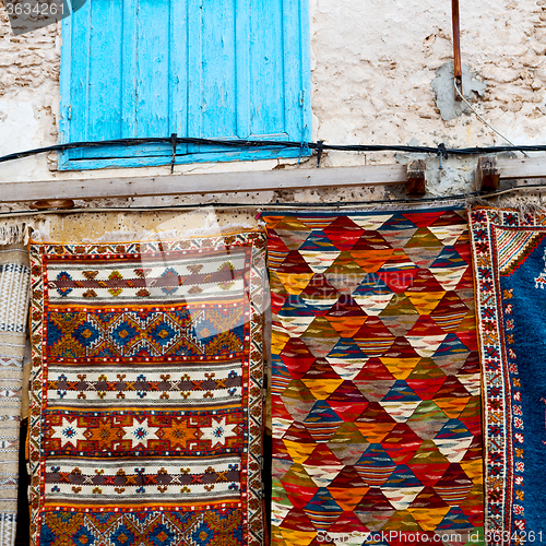 Image of blue window in morocco africa old construction and brown wall re
