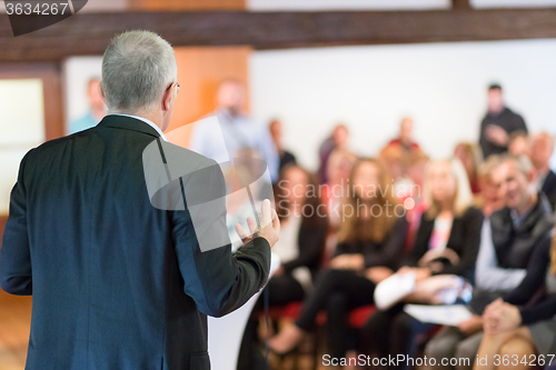 Image of Speaker at Business Conference and Presentation.