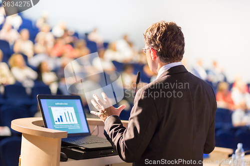 Image of Speaker at Business Conference and Presentation.