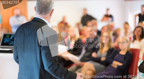 Image of Speaker at Business Conference and Presentation.