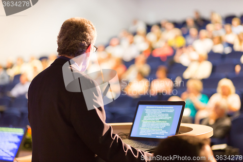 Image of Speaker at Business Conference and Presentation.