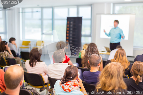 Image of Speaker Giving a Talk at Business Meeting.