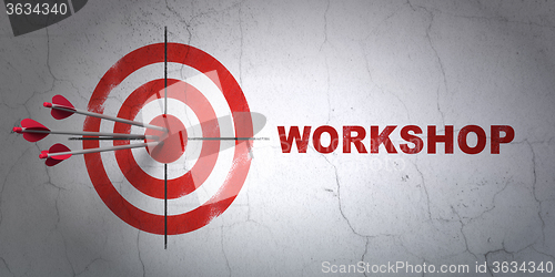 Image of Education concept: target and Workshop on wall background