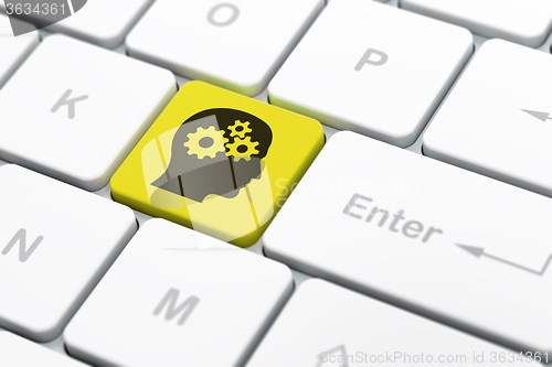 Image of Business concept: Head With Gears on computer keyboard background