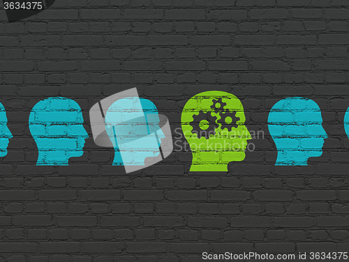 Image of Finance concept: head with gears icon on wall background