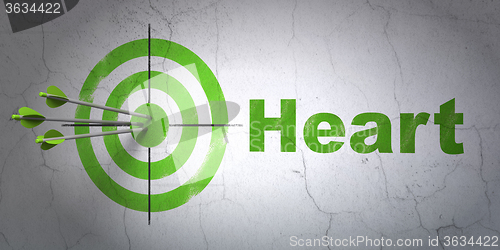 Image of Healthcare concept: target and Heart on wall background