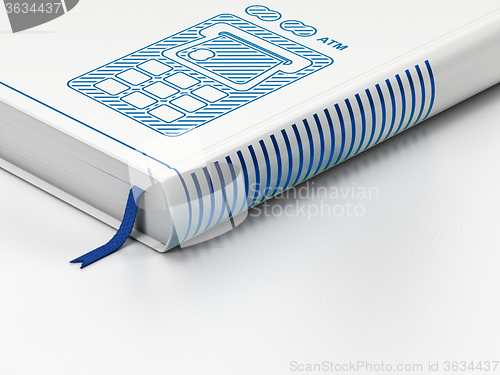 Image of Money concept: closed book, ATM Machine on white background