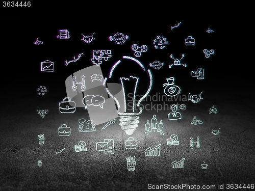 Image of Business concept: Light Bulb in grunge dark room