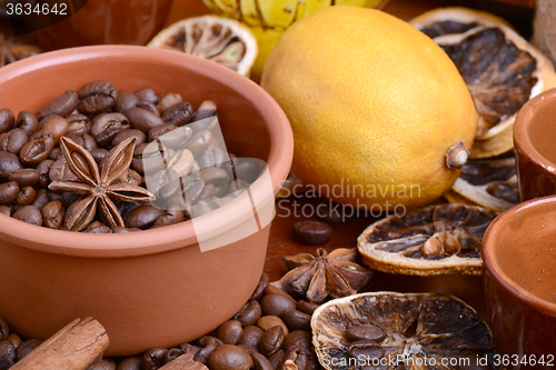 Image of coffee beans, old lemon, cinnamon and aroma spice