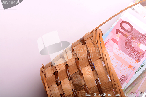 Image of european money on wooden basket