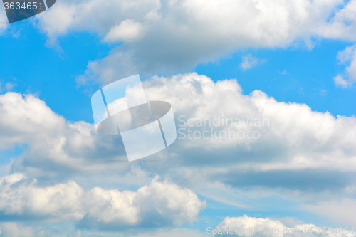 Image of white fluffy clouds in the blue sky