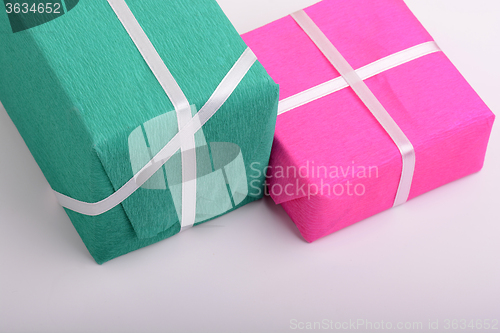 Image of gift box set with white ribbon on white background