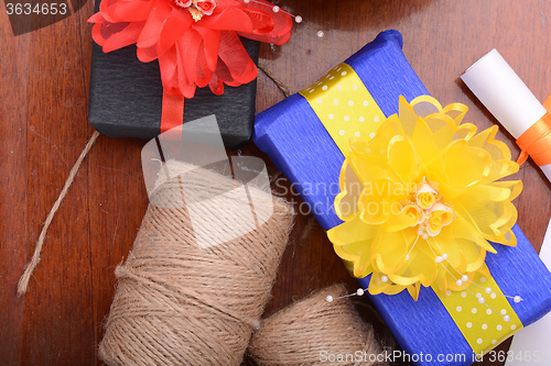Image of color gift boxes on wooden background