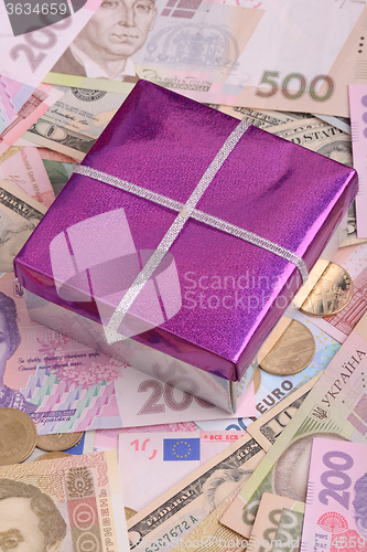 Image of american money and red gift box, european money