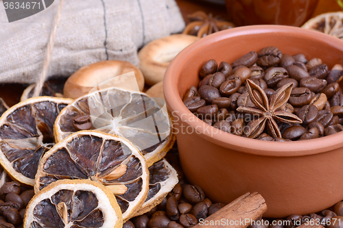 Image of coffee beans, old lemon, cinnamon and aroma spice