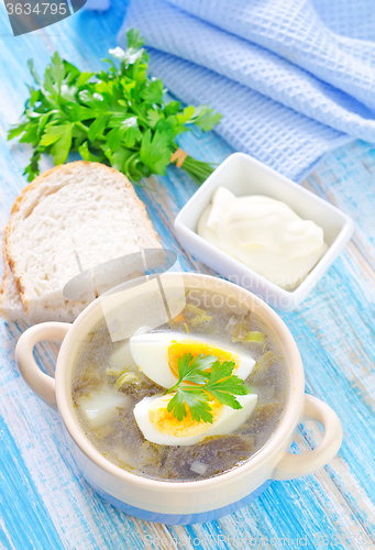 Image of green soup with boiled eggs