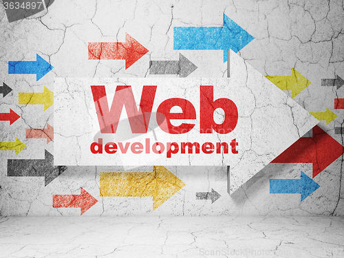 Image of Web design concept: arrow with Web Development on grunge wall background