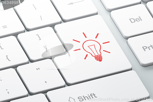 Image of Finance concept: Light Bulb on computer keyboard background