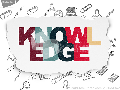 Image of Studying concept: Knowledge on Torn Paper background