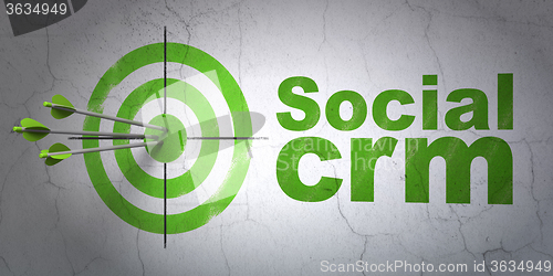 Image of Advertising concept: target and Social CRM on wall background