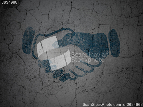 Image of Political concept: Handshake on grunge wall background