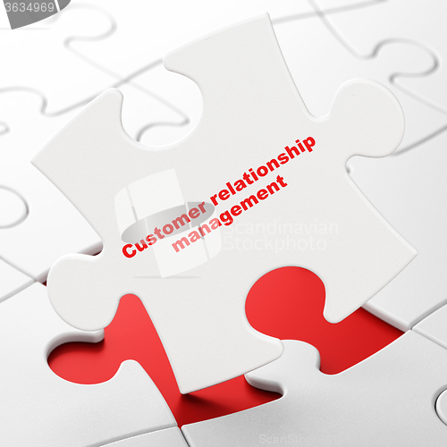 Image of Marketing concept: Customer Relationship Management on puzzle background