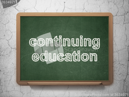 Image of Learning concept: Continuing Education on chalkboard background