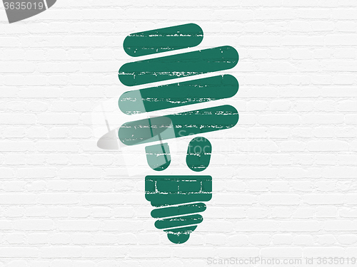 Image of Finance concept: Energy Saving Lamp on wall background