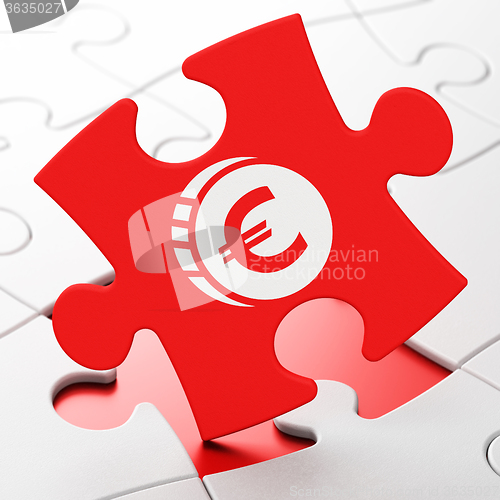 Image of Money concept: Euro Coin on puzzle background