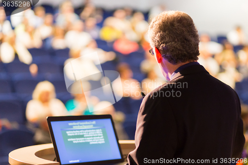 Image of Speaker at Business Conference and Presentation.