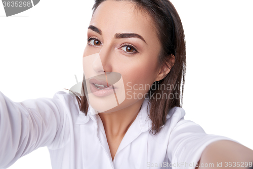 Image of Beautiful woman taking selfie