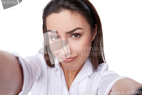 Image of Beautiful woman taking selfie