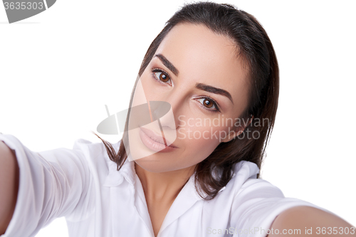 Image of Beautiful woman taking selfie