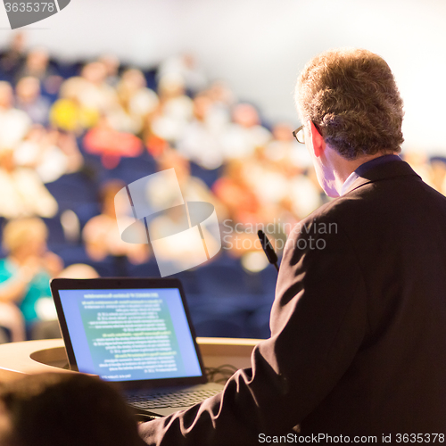 Image of Speaker at Business Conference and Presentation.